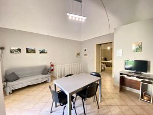 a living room with a table and a couch at La Ginestra in Corleone