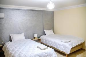 Una cama o camas en una habitación de Gueliz Appartement