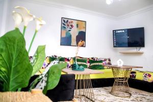 Una televisión o centro de entretenimiento en Gueliz Appartement