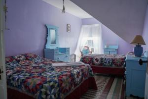 a bedroom with two beds and a window at The 8th Maine Regiment Lodge and Museum in Peaks Island +62 photos