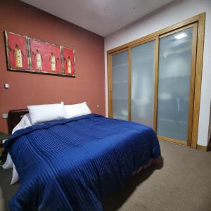 Ένα ή περισσότερα κρεβάτια σε δωμάτιο στο Appartement front mer à Casablanca