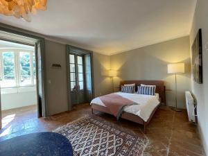 a bedroom with a bed with two pillows on it at Villa Oleandro in Casima