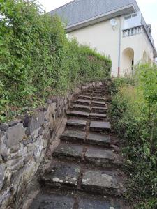 a set of stone steps leading up to a house at Appartement avec vue exceptionnelle in Blanzat
