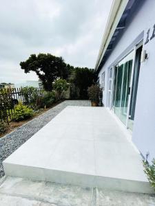 a walkway outside of a building with a window at Lux Sleek City Haven in Cape Town