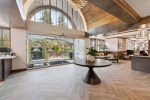 a large living room with a table in the middle at Lodge Tower 283 in Vail