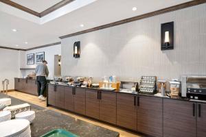 a man standing at the counter of a restaurant kitchen at Lodge Tower 283 in Vail