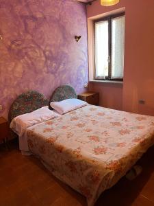 a bedroom with a bed with two chairs in it at Albergo Bar Brenve in Issogne