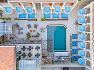 an overhead view of a building with blue plates on the wall at SDesign Paraty Hotel in Paraty