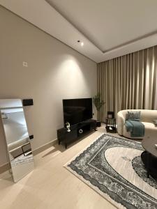 TV a/nebo společenská místnost v ubytování Entire Modern and comfy Apt