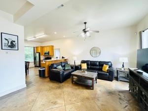 a living room with a couch and a table at Chateau 8 in Hammond