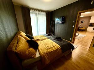 Ένα ή περισσότερα κρεβάτια σε δωμάτιο στο Garden Residence Terrace Apartment