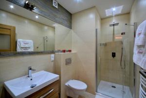 Kúpeľňa v ubytovaní StaraPolana.EU & SPA + 7 fotografií