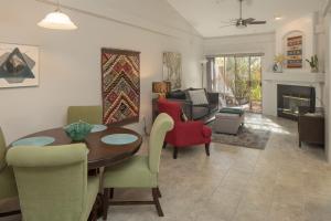 a living room with a table and chairs and a couch at Elegant and updated - In the heart of Sedona in Sedona