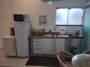 Køkken eller tekøkken på Quitinete Balneário