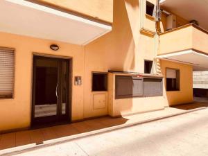 an open door of a building with a door at Silvios House Nuovissimo appartamento moderno con box auto in Sassari