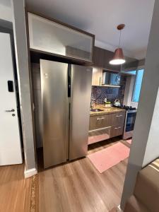 a kitchen with a stainless steel refrigerator at Allianz Parque , Perdizes in São Paulo +21 photos