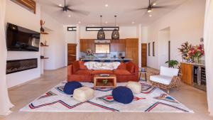 a living room with a couch and a table at Villa Damiana by The Agency Baja in El Pescadero