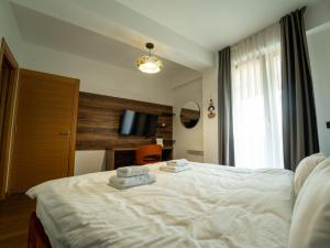 Ένα ή περισσότερα κρεβάτια σε δωμάτιο στο Pino Monte