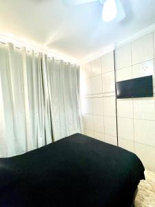 TV a/nebo společenská místnost v ubytování Estação Praia VLT