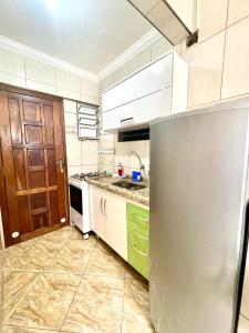 Kuchyň nebo kuchyňský kout v ubytování Estação Praia VLT