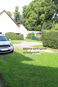 a car parked in the yard of a house at Nocleg pod Ksiązem in Wałbrzych