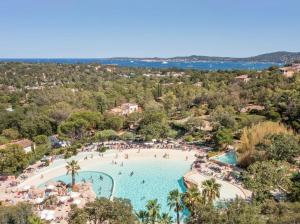 an aerial view of a pool at a resort at Appartement vue mer Domaine Les Restanques Grimaud in Grimaud