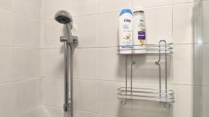 a shower with a shower head in a bathroom at Silvi Marina - Appartamenti Sesia in Silvi Marina +29 photos