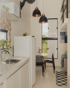 Η κουζίνα ή μικρή κουζίνα στο Loft Aconchegante & bem localizado III