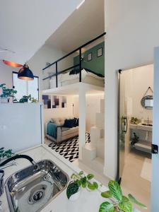 Η κουζίνα ή μικρή κουζίνα στο Loft Aconchegante & bem localizado III