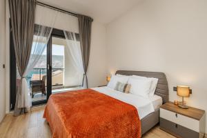 a bedroom with a bed and a large window at Novi Hills Residence in Španjola +76 photos
