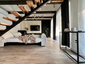 a bedroom with a bed and a television in it at Silent Lake in Látrány +27 photos