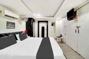 Μια τηλεόραση ή/και κέντρο ψυχαγωγίας στο Hotel O Mani bhai patel +22 φωτογραφίες