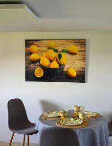 a painting of a bowl of lemons on a table at Rosa in Rydułtowy