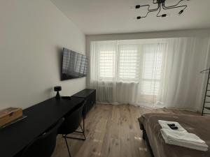 Et tv og/eller underholdning på Nowoczesny Apartament Centrum przy PKP