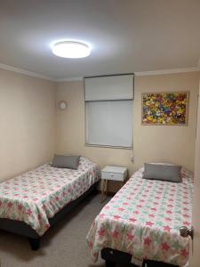 Postel nebo postele na pokoji v ubytování Departamento en Villarrica con vista al volcán para 4 personas + 9 fotografií