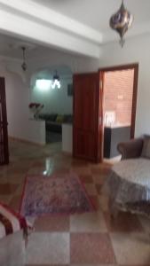 a living room with a couch and a table at khadija oulidia in Oualidia +2 photos