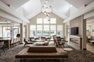 a living room with a couch and a table at Residence Inn Gainesville I-75 in Gainesville