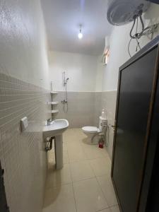 a bathroom with a sink and a toilet at Havre de paix dans les montagnes in Amizmiz +27 photos