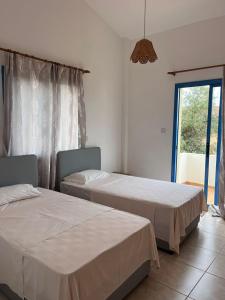 Ένα ή περισσότερα κρεβάτια σε δωμάτιο στο Queen Eyridiki Luxury Villa 1