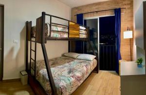 a bedroom with a bunk bed in a room at El Rincón de Monte Alban in Oaxaca City