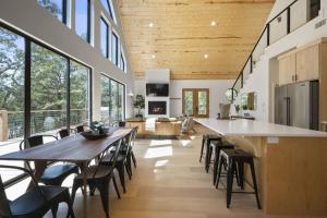 a kitchen and living room with a large table and chairs at A-Frame of Mind - Modern Farmhouse in Stephens Gap