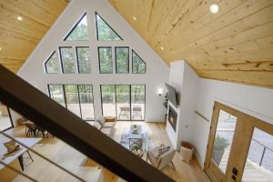 an overhead view of a living room with a large window at A-Frame of Mind - Modern Farmhouse in Stephens Gap +85 photos