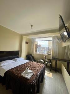 Katil atau katil-katil dalam bilik di Hostal El Encanto