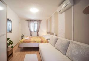 מיטה או מיטות בחדר ב-Guest Accomodation Žura