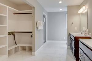 a white bathroom with a shower and a sink at Nashville's Music City House, Dolly Approved! in Nashville +16 photos