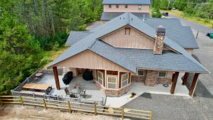 an aerial view of a house with a roof at New! Black Bear Inn - Pet friendly - trailer parking - walk to lake - rustic in Donnelly