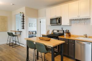 a kitchen with a wooden table and a counter top at Beautiful Chicago 2BD 1BA in Chicago