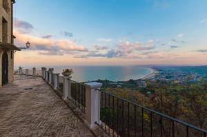 a balcony of a building with a view of the ocean at Casa Conti Trivelli in Vasto