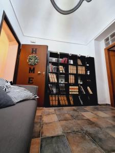 a room with a display of wine bottles at Casa Conti Trivelli in Vasto +13 photos