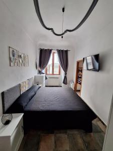 a bedroom with a large bed and a window at Casa Conti Trivelli in Vasto
